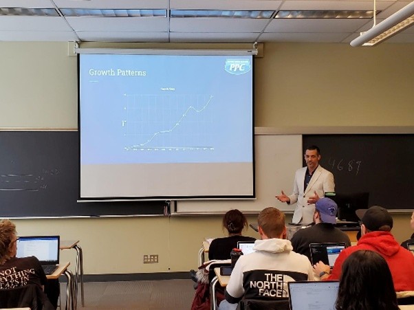 Picture Perfect Cleaning representative presenting to university students about growth and commercial cleaning services for schools in Calgary and Edmonton