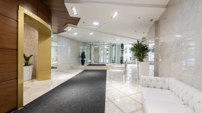 Pristine condo lobby with polished marble floors and elegant furnishings, professionally maintained by Picture Perfect Cleaning in Calgary and Edmonton